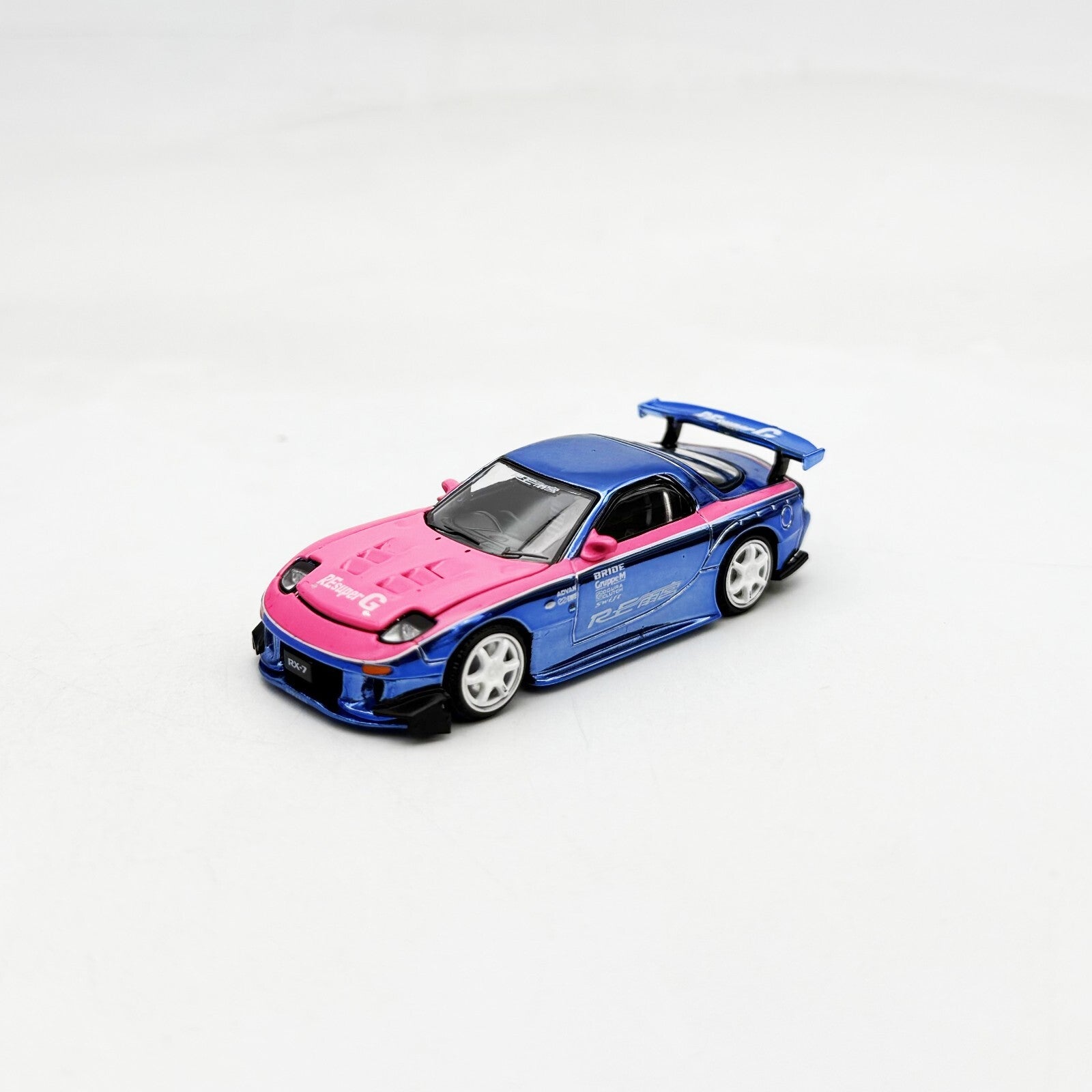 Pop Race 1:64 Mazda RX7 Re Amemiya Wide Body Chrome Blue